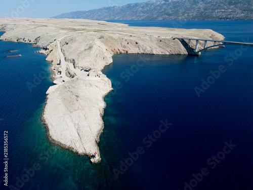 Fotografie Aerial View of Pag Bridge and Rugged Coastline of Pag Island, Croatia