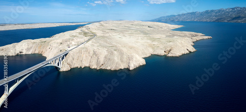 Obraz na płótnie Aerial View of Pag Bridge and Rugged Coastline of Pag Island, Croatia