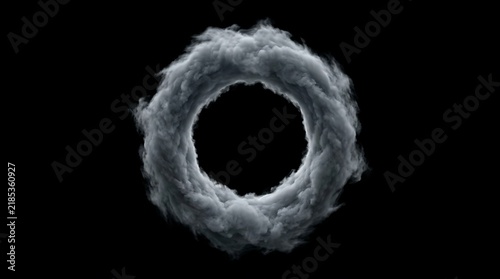 Smoke ring forms a circular swirling cloud vortex against a solid black background.