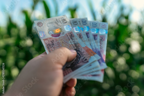 British pound sterling GBP banknotes representing United Kingdom currency finance banking and money concept