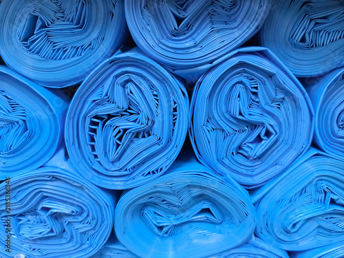 Vibrant blue rolls stacked in perfect harmony showcasing creativity