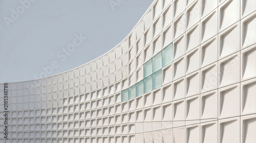 Modern white architectural facade grid pattern with glass accent tiles
