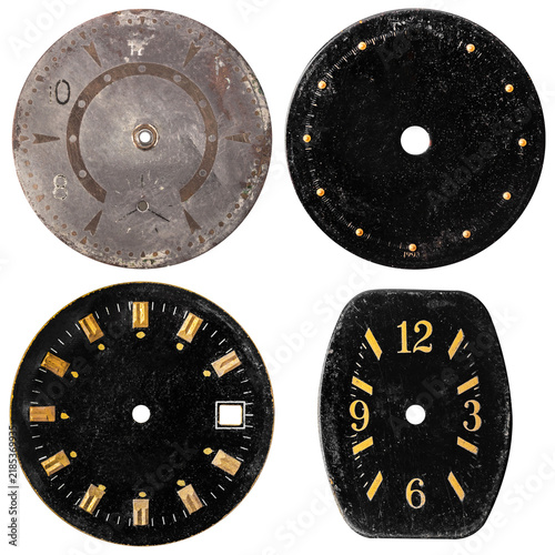Isolated photo of various black vintage worn clock or watch face on white background.