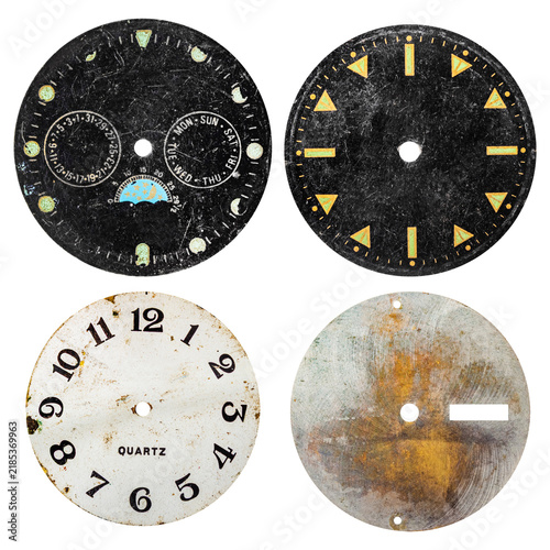 Isolated photo of black and white vintage worn clock or watch face on white background.