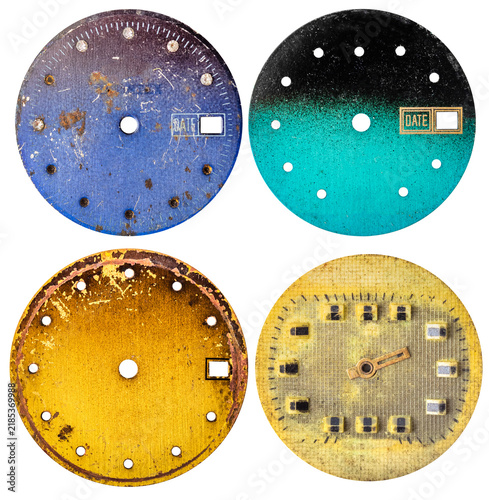 Isolated photo of various colored worn vintage clock or watch face on white background.
