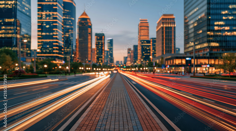 Obraz premium Urban Boulevard With Colorful Light Trails Between Illuminated City Buildings