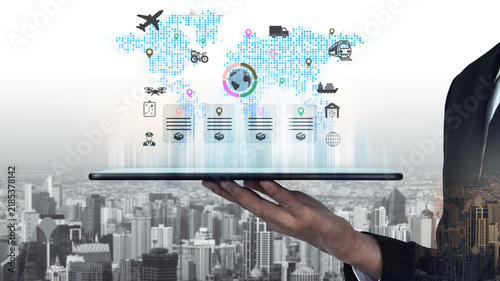 Фотография Digital concept showcasing global connectivity with tablet displaying maps and icons representing transportation, logistics, and technology in a modern urban environment