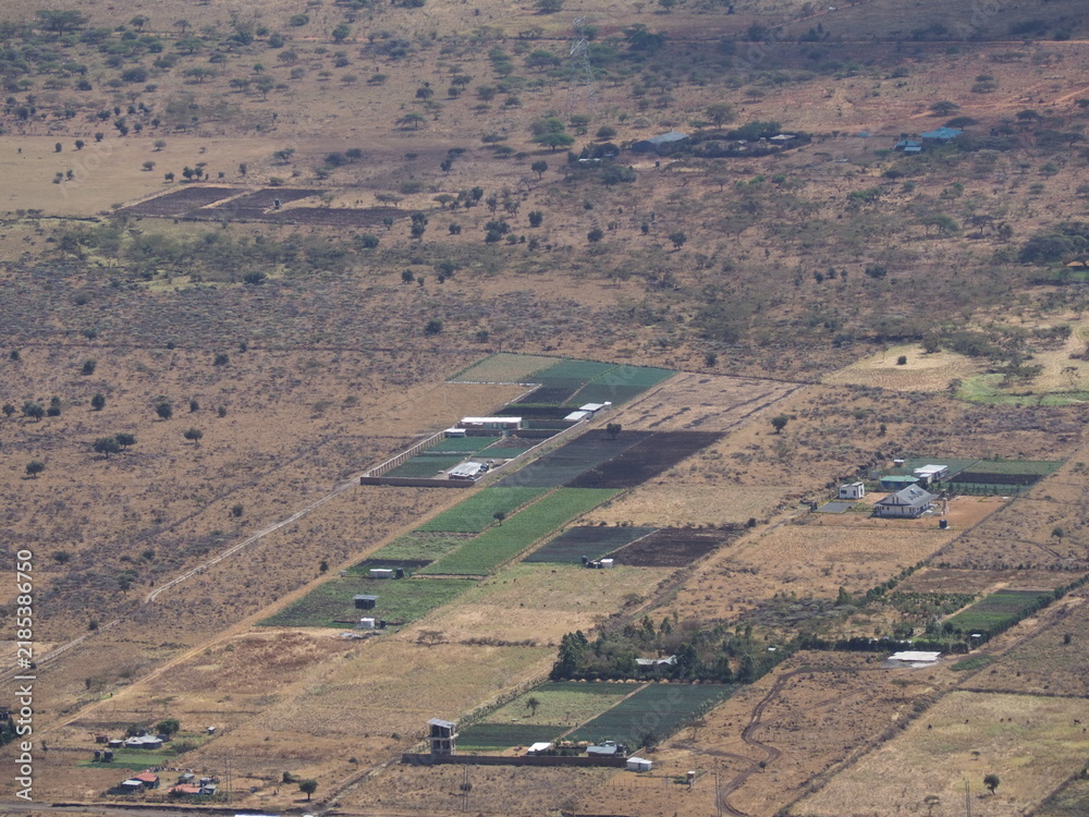 Obraz premium Aerial View of Agricultural Farmland Plots and Greenhouses in Rural Landscape Ngong Hills Kenya