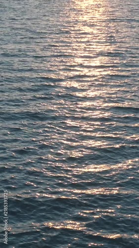 Golden Sun Reflection on Calm Sea Surface