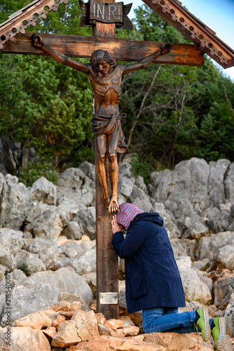 Картината върху платно A wooden crucifix with Jesus Christ on Mount Podbrdo, the Apparition Hill overlooking the village of Medjugorje, Bosnia and Herzegovina