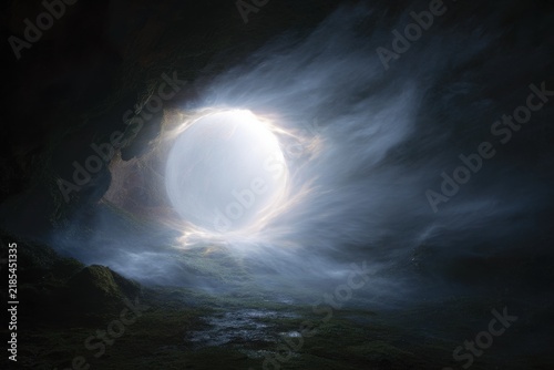 Ethereal portal in a cave with a glowing orb and misty doorway opening for fantasy background and surreal landscape banner use