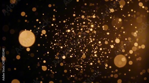 Golden bokeh lights on a dark background, abstract background, festive, glowing particles