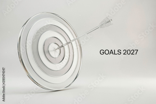Goals 2027 business target concept, glass bullseye with arrow hitting center, corporate strategy and future planning vision
