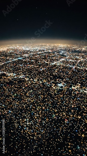 The view of the city's night lights can be seen from above, like twinkling stars.