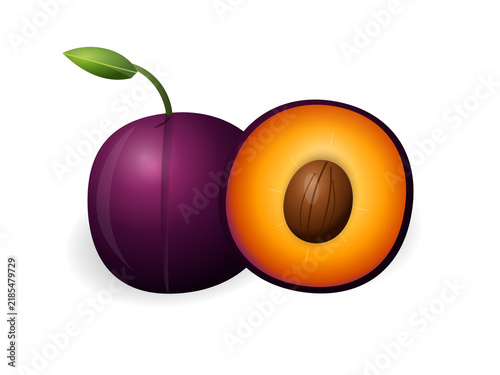 Fresh ripe purple plum whole and sliced in half with