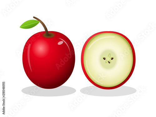 Whole and sliced red apple fruit with green leaf on
