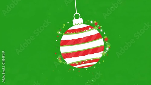 Striped red and white Christmas bauble ornament hanging and swinging against solid green background. Perfect for holiday video greeting cards and festive digital projects.