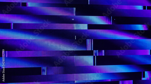 Abstract background with blue and purple neon light stripes and digital patterns