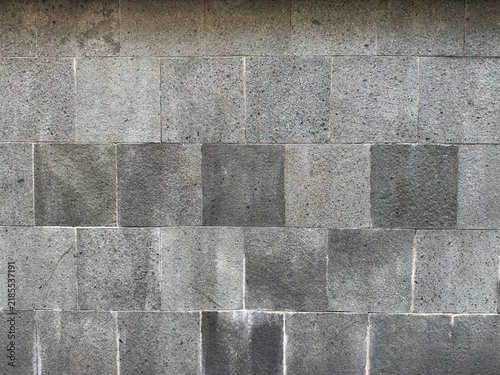 Modern dark grey lava stone wall tile texture background, natural volcanic stone surface with minimalist design for architecture and interior