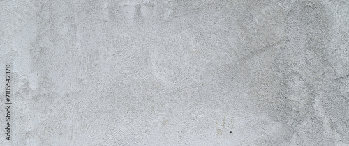 Obraz na płótnie Wall texture background featuring faded paint, rustic plaster, subtle scratches, and distressed details for an authentic vintage surface.