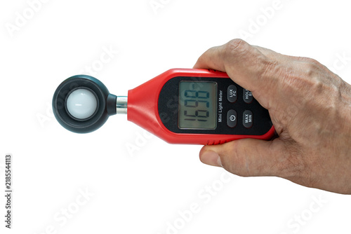 Close-up Hand of man using digital lux or light meter on transparent background