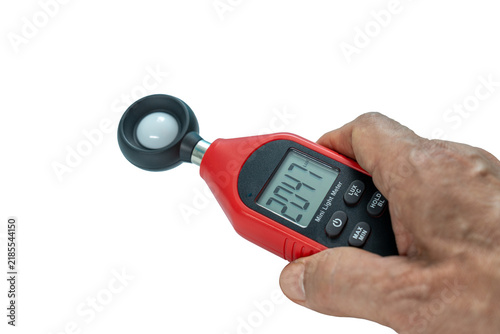 Close-up Hand of man using digital lux or light meter on transparent background
