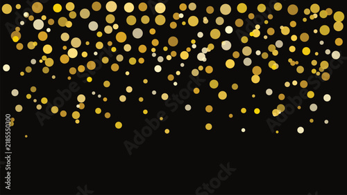 Falling gold circles on black background, festive confetti pattern