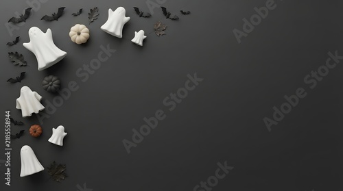 Top view of delicious homemade halloween cookies shaped like ghosts and bats on a dark black background