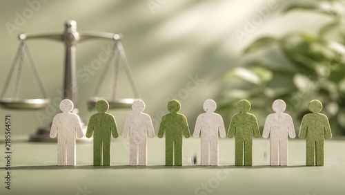 Green And White Wooden Human Figures In Row Standing In Front Of Justice Scale