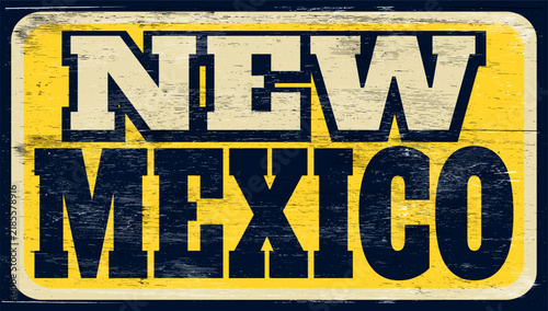 Aged and worn New Mexico sign on wood