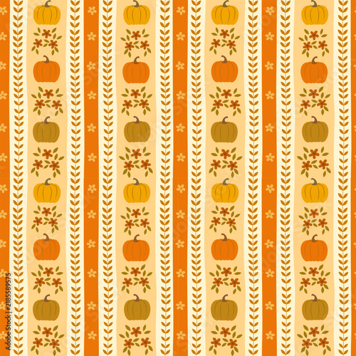 Seamless pattern with autumn pumpkins, small flowers, and leaf branches on a striped background