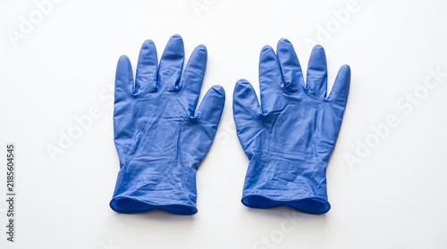 Top view of blue disposable nitrile medical gloves palms up isolated on white background for sanitary protection