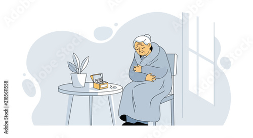 Elderly Woman Feeling Unwell Wrapped In Blanket Sitting Alone Beside Medicine