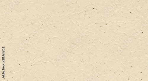 Textured beige paper background with subtle fibers