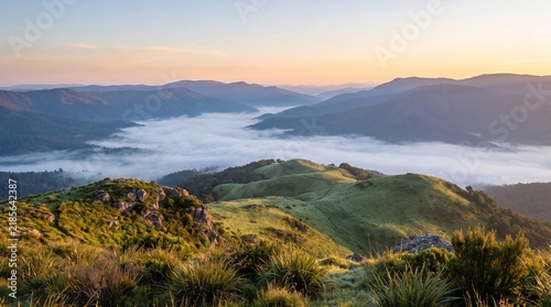 Peaceful Mountain Valley at Sunrise Covered in Thick Morning Mist
