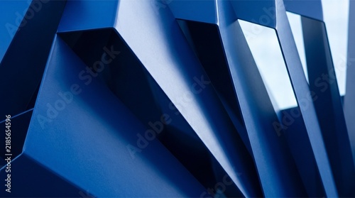 Abstract blue metal geometric structure with sharp angles and modern architectural lines.