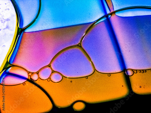Bild auf Leinwand Abstract oil in water macro photography with purple and orange hues for artistic background designs
