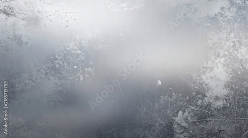 Frost patterns form intricate, delicate designs on a cold glass surface, creating a wintry, icy texture.