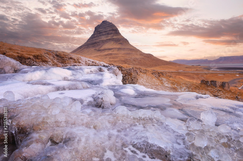 Beautiful landscape of Kirkjufellsfoss with background of remark