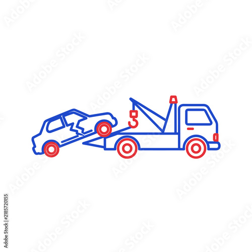 Tow truck transporting a damaged vehicle on a flatbed trailer