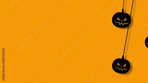 Spooky Halloween Pumpkin Faces Swinging Loop Animation on Orange Background, Hanging Black Jack O Lantern Silhouettes with Copy Space for Horror, Seasonal, Greeting Card, Invitation Party