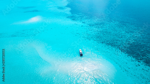 Aerial view of Summer lagoon Ripples in the sand at low tide on a beach with sandbar background and blue sea in Maldives island
