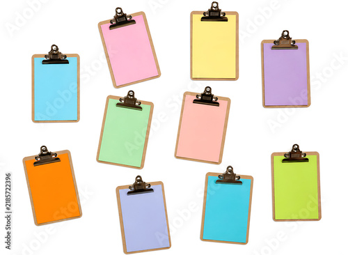 Colorful blank clipboard collection isolated on a white background, featuring pastel and vibrant colored paper sheets with metal clips. Clean minimal composition for office, business, planning and sta