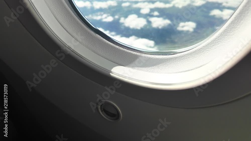 A view of clouds through an airplane window.