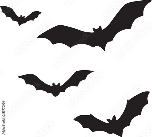 Set of black silhouettes of flying bats isolated on white background