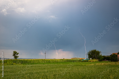 Konstfotografi Double lightning strike from a daytime thunderstorm in the Mures valley, central Transylvania, Romania