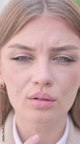 Close up of Face of Young Businesswoman Looking Shocked at Camera, Vertical Video