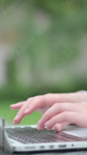 Close up of Hands of Young Businesswoman Typing on Laptop Keyboard, Vertical Video