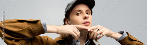 Obraz na plátně Young man showcases stylish flair in modern urban setting