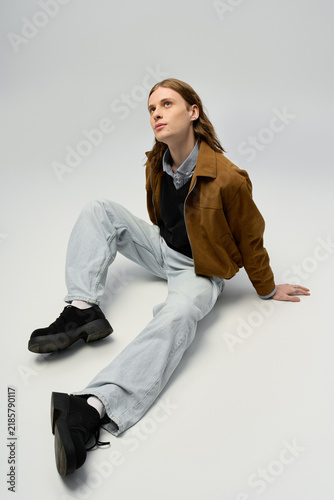 Принти на полотні Young man embraces stylish fashion with androgynous flair in modern setting
